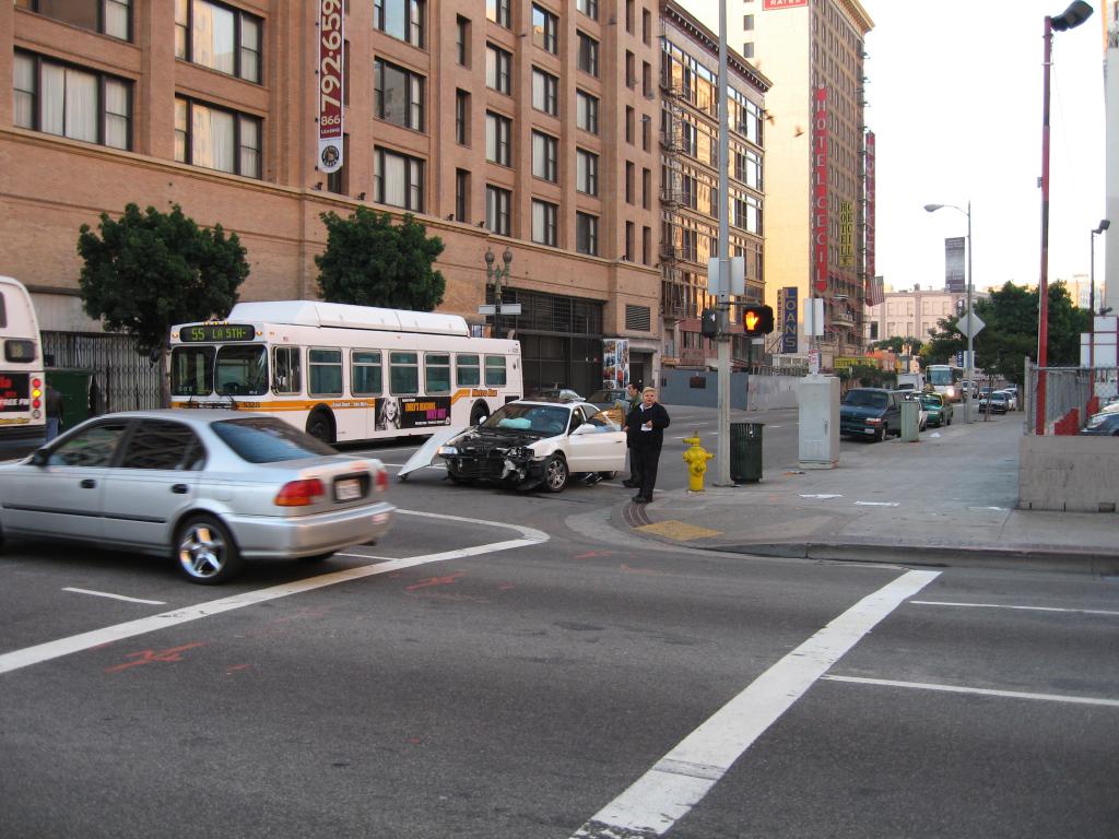 car smashed by bus