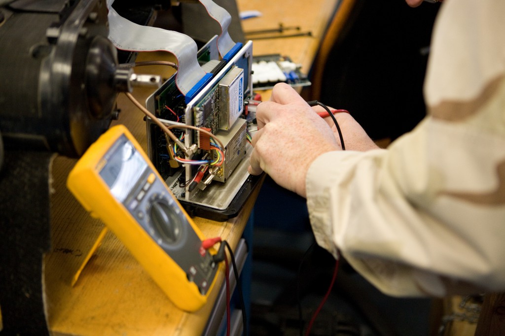 Technician Testing Foster-Miller Robot&#39;s RF Module