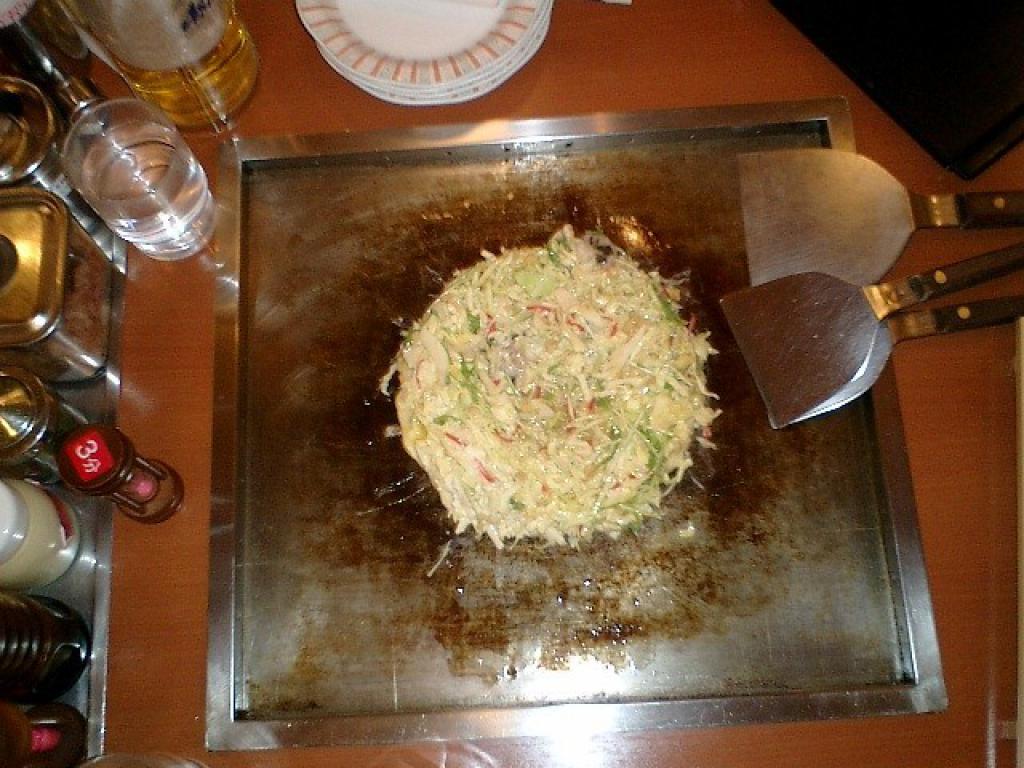 okonomiyaki cooking on the grill