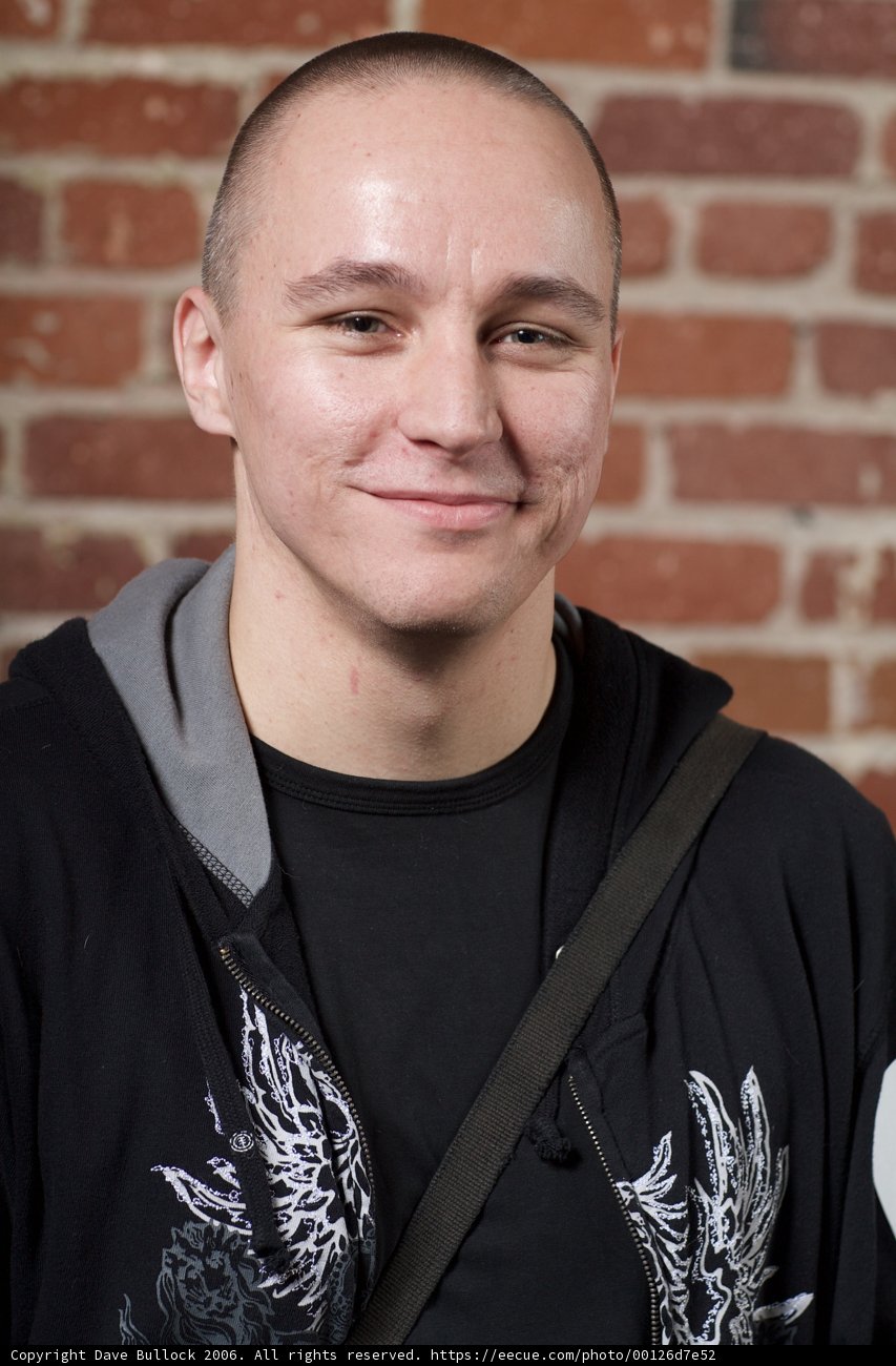 Smiling Man in Black Jacket