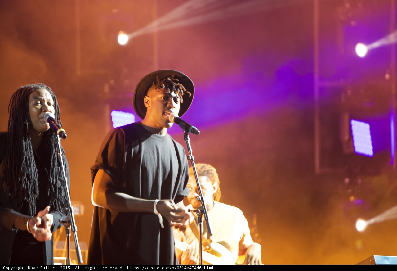 Solange Band Dreadlocks Eyes Closed Hat Vocalist Bassist LED Panels Orange Haze