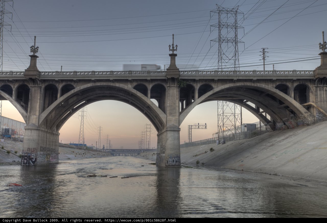 Majestic Arch Bridge over the Flowing River