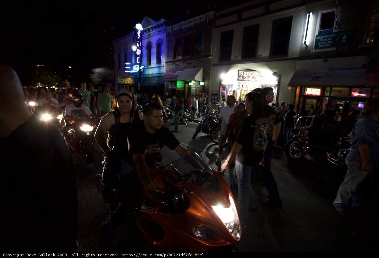Motorcycles Cruise Through Austin at Night