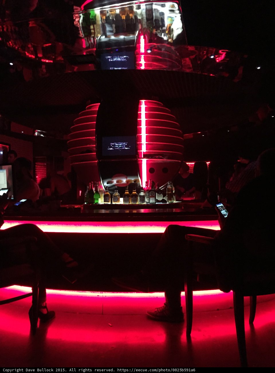 Urban Nightlife at a Red-Lit Bar