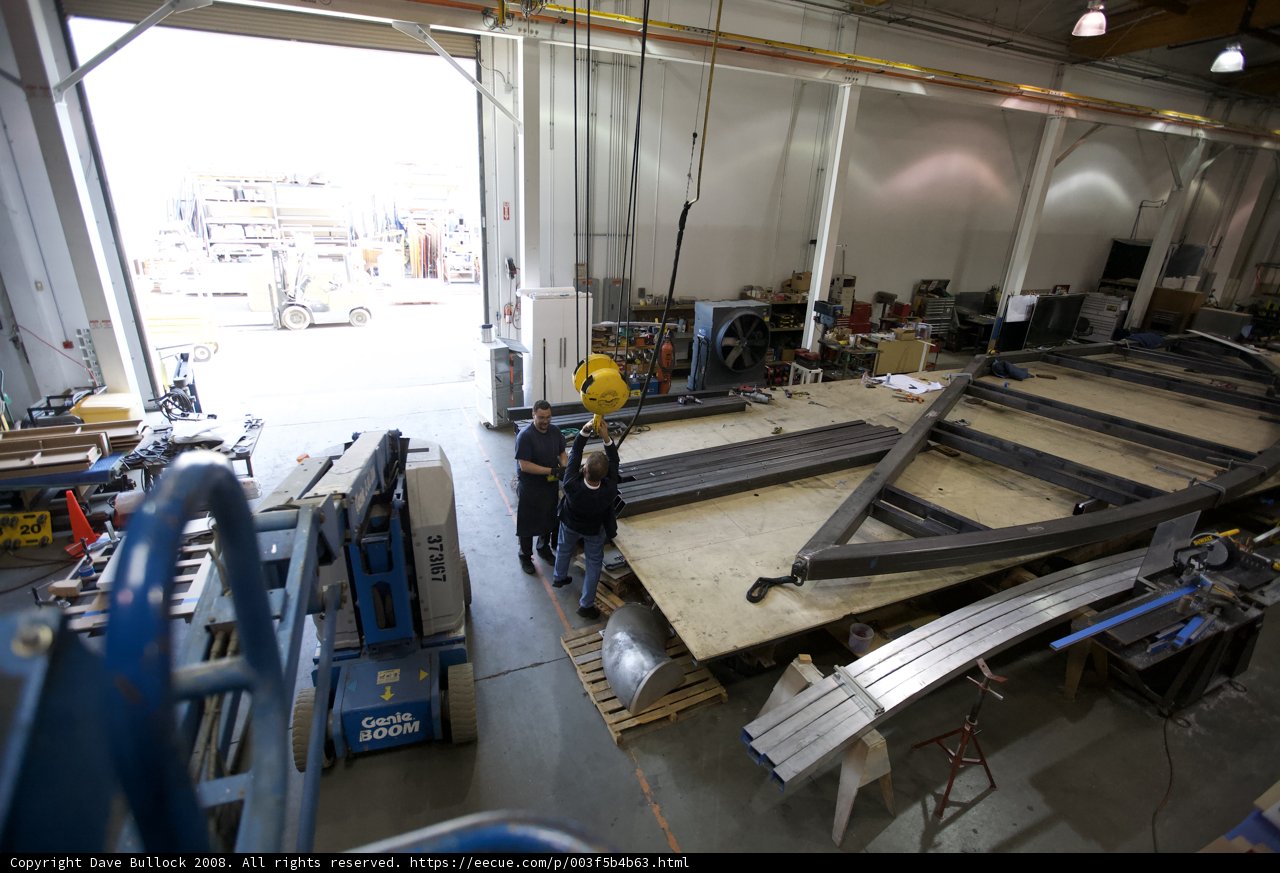 Boat building in a busy factory