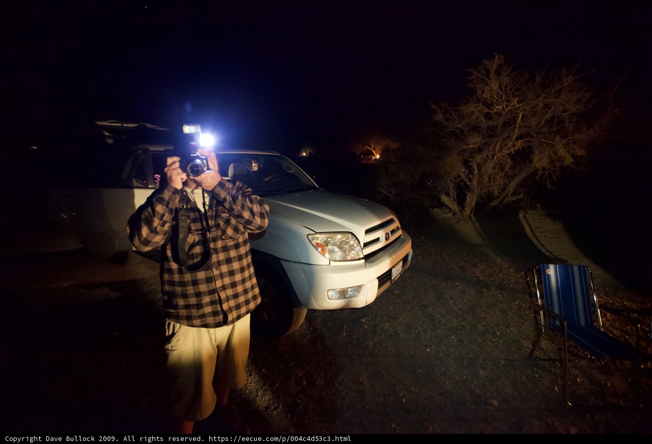 Nighttime Photography of a Man and His Truck