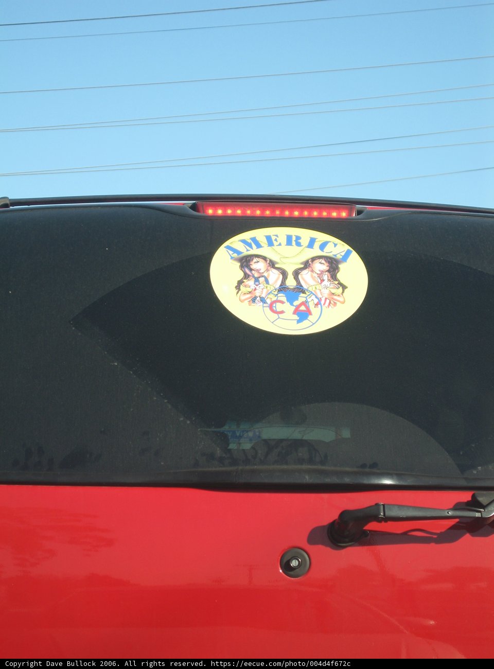 Emblem Sticker on Red Car