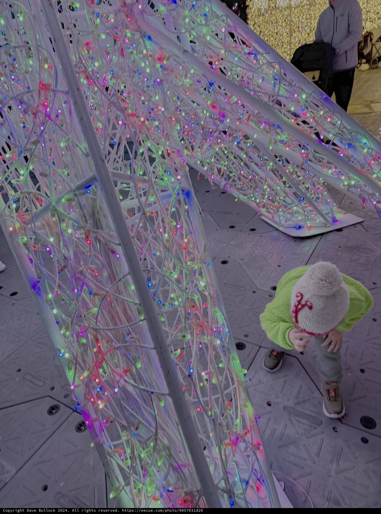 Child Explores Colorful Interactive Light Installation