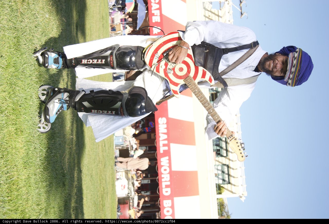 The Helmeted Guitarist Performs in the Open Air