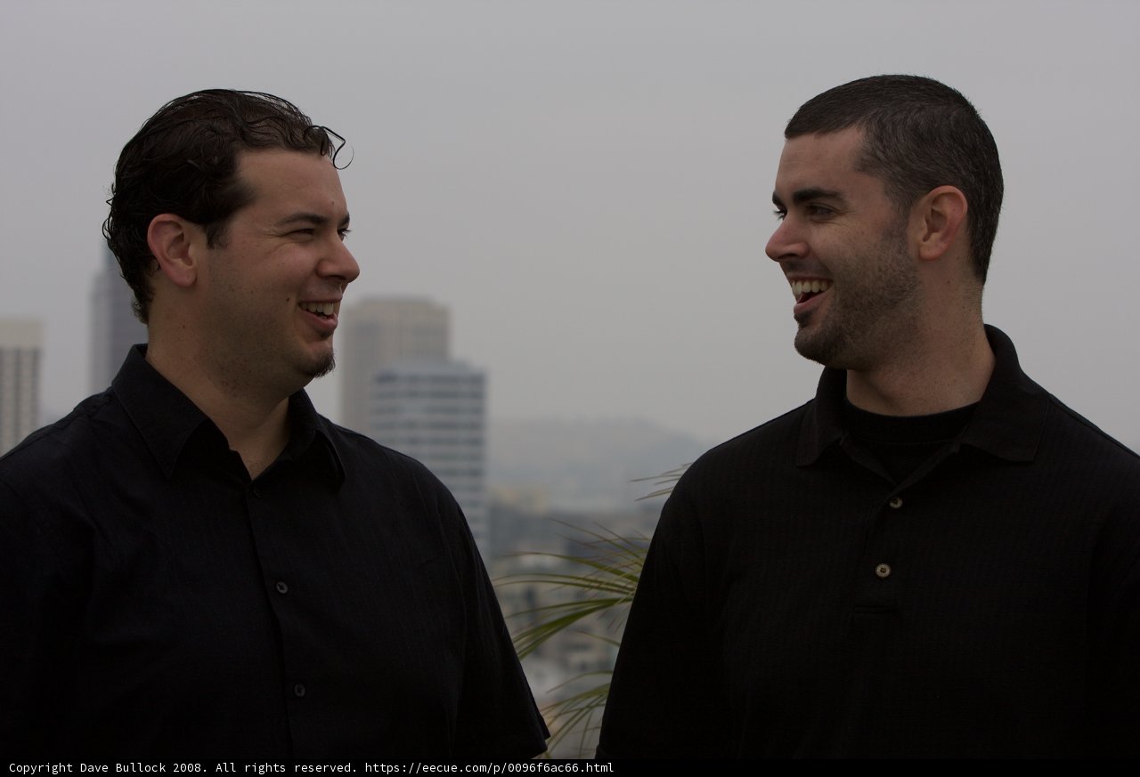 Two happy men in black shirts