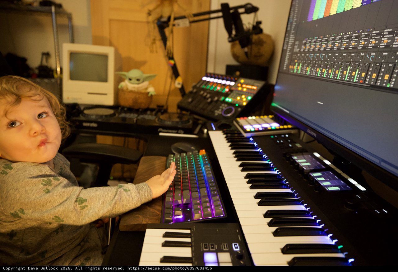 Young Child Explores Music Production Studio Setup