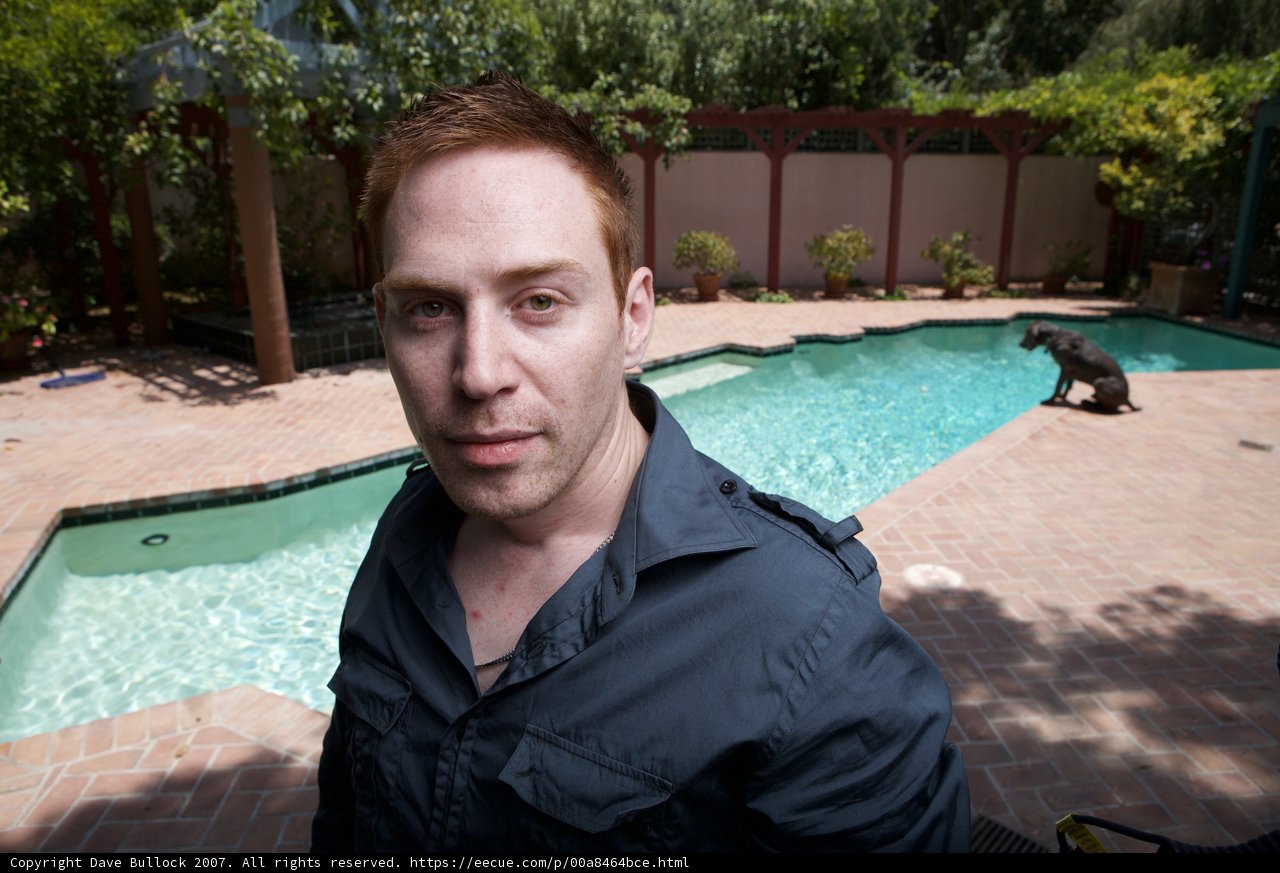 A Man and his Furry Companion by the Pool