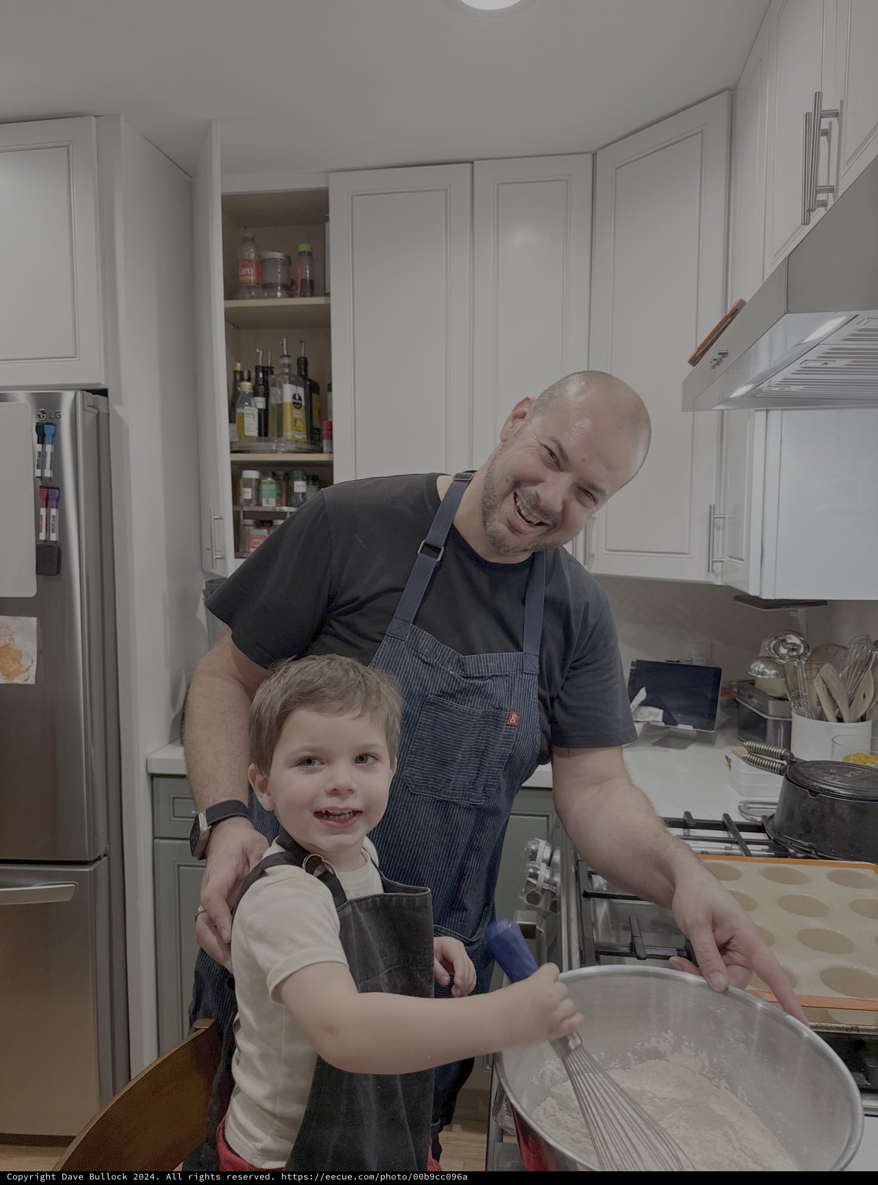 Father and Son Cooking Together in Kitchen