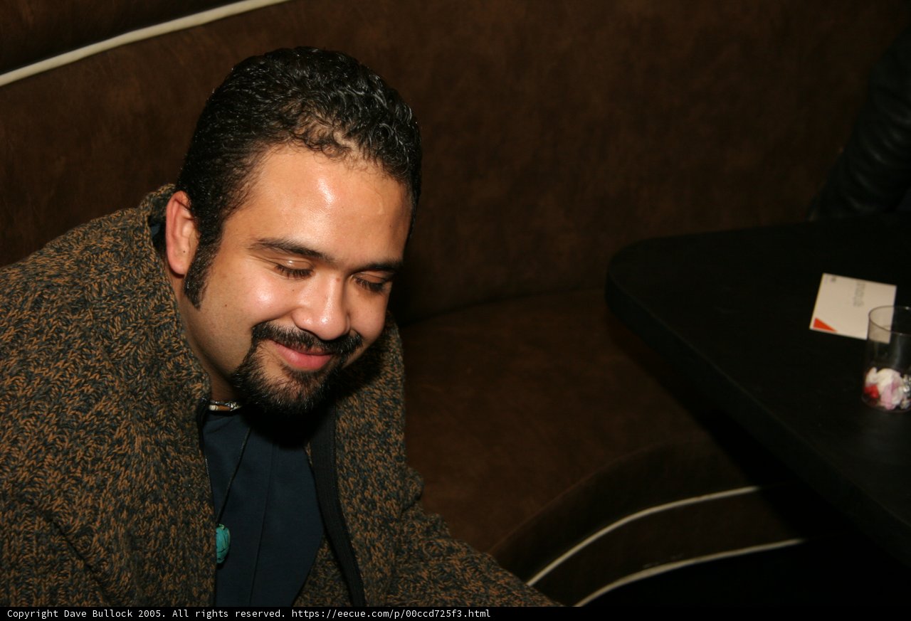 Brown Jacketed Man on the Couch