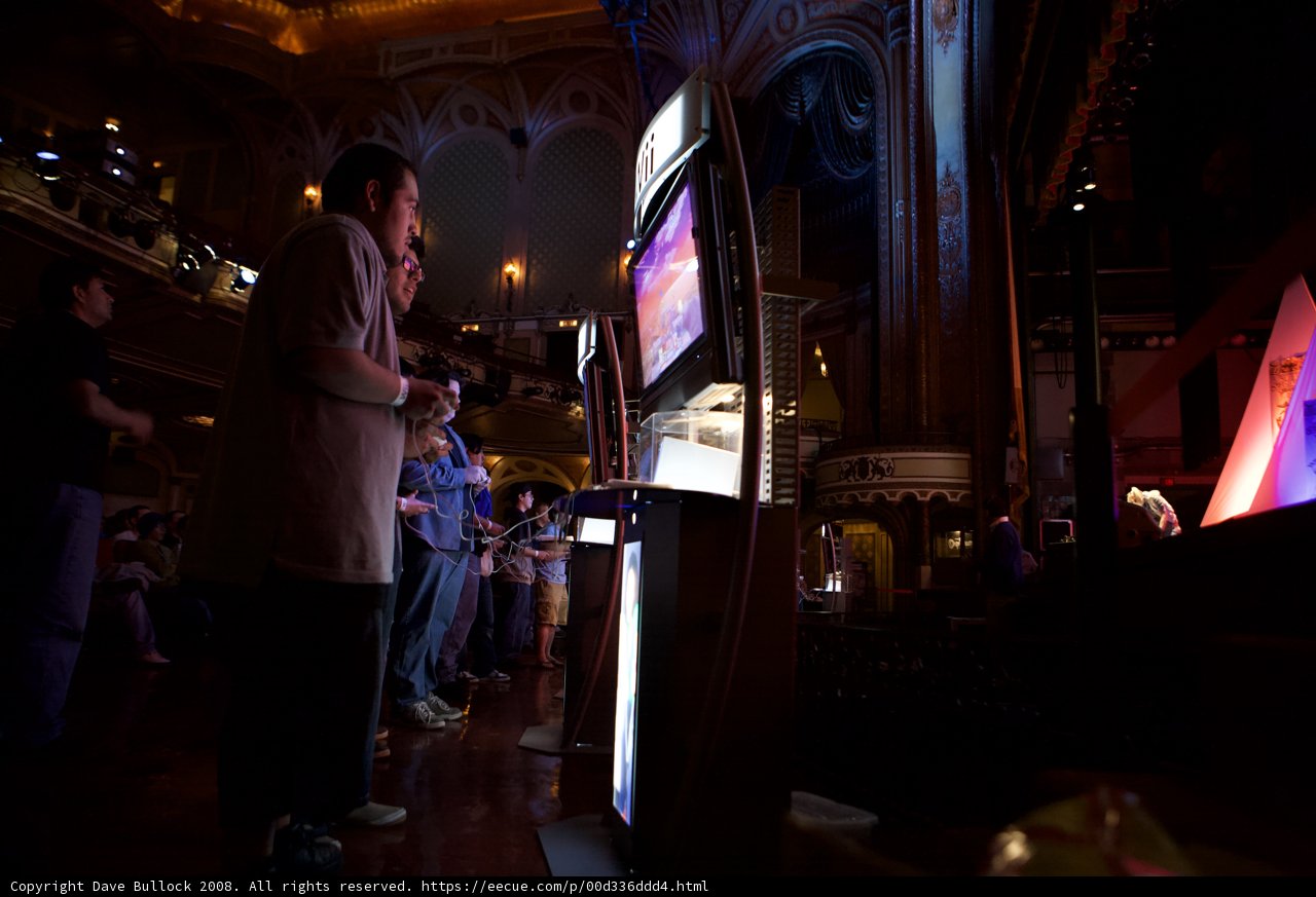 Gaming enthusiasts gather at a pub to watch the latest release
