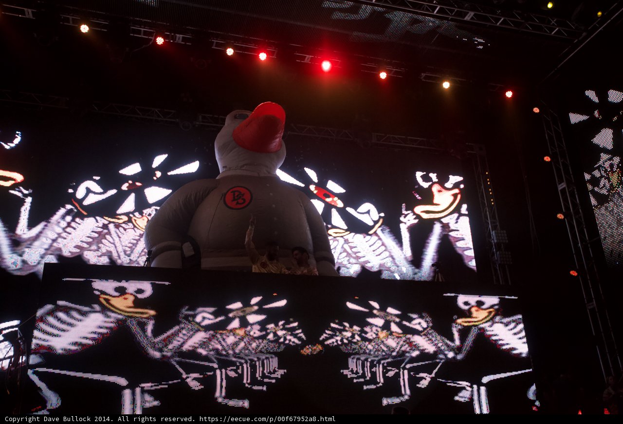 Spotlight on a White Robot Performer