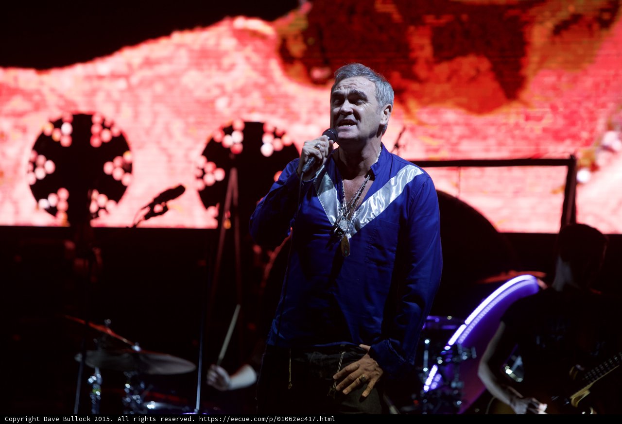 Morrissey Singing Hand On Hip Blue Shirt Drums Cymbals LED Head Bassist Two Circular Lights Red Screen