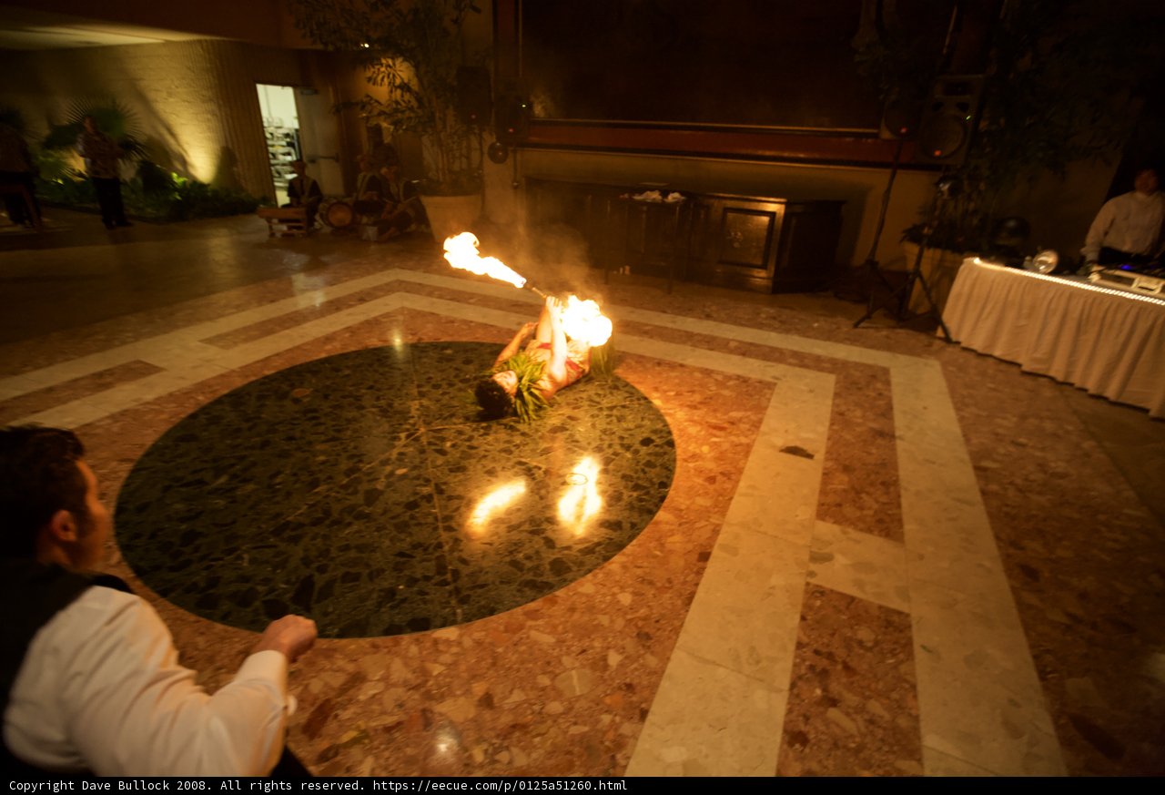 Man sitting by fire on the floor