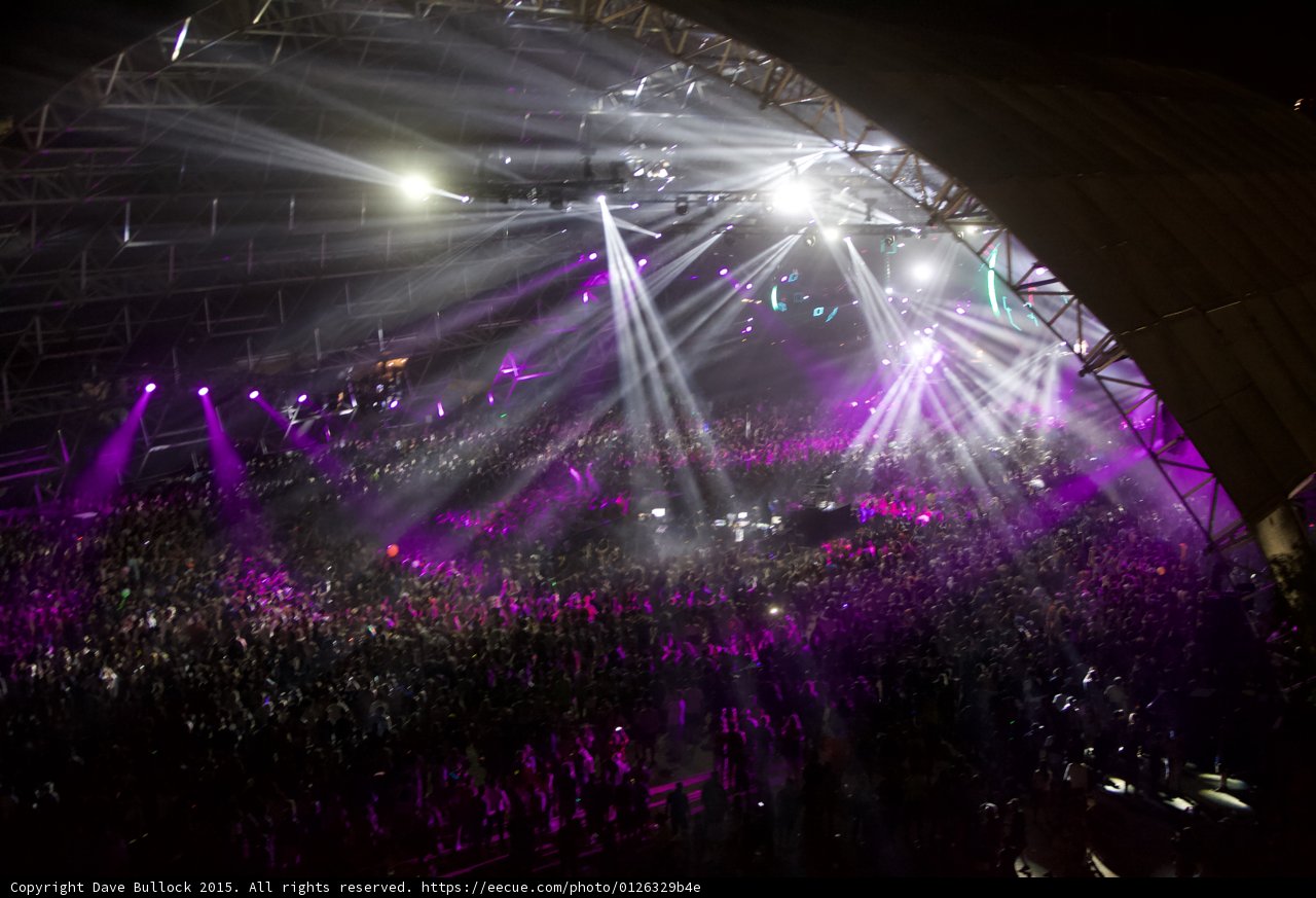 Energized Crowd Bathed in Radiant Lights at Coachella