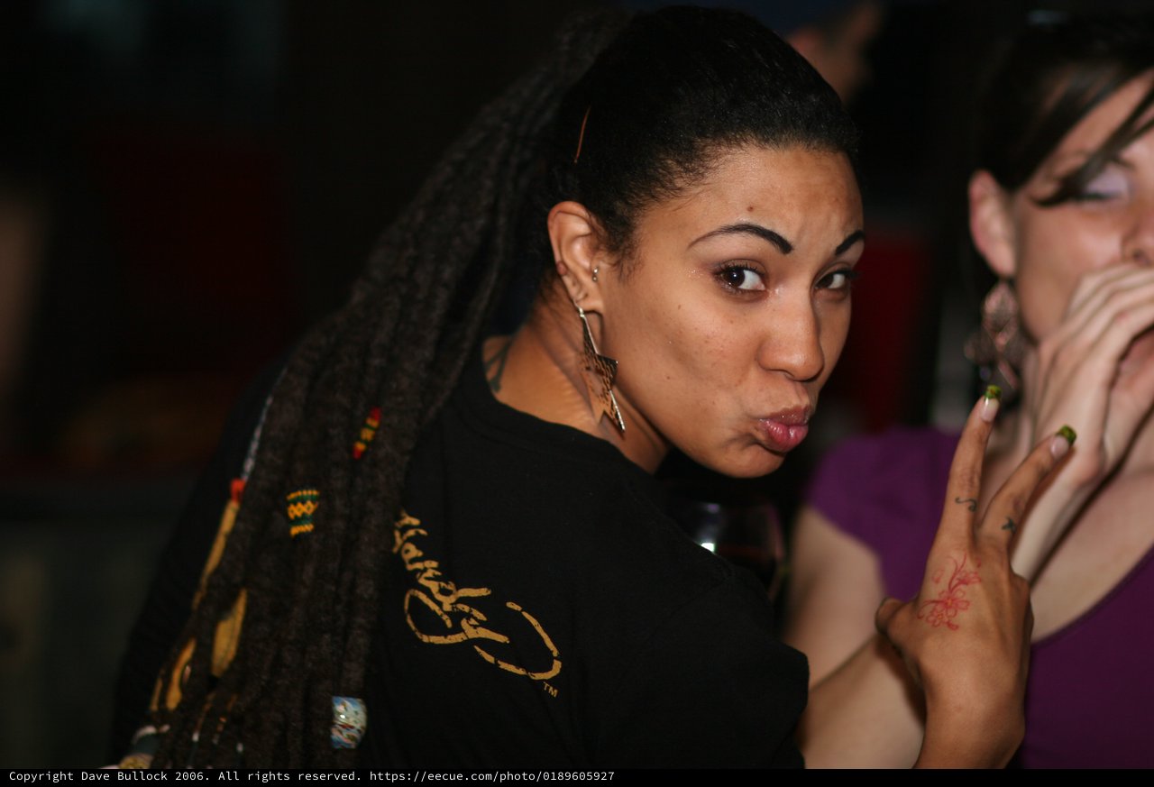 Playful Expression at a Nightclub Social Gathering