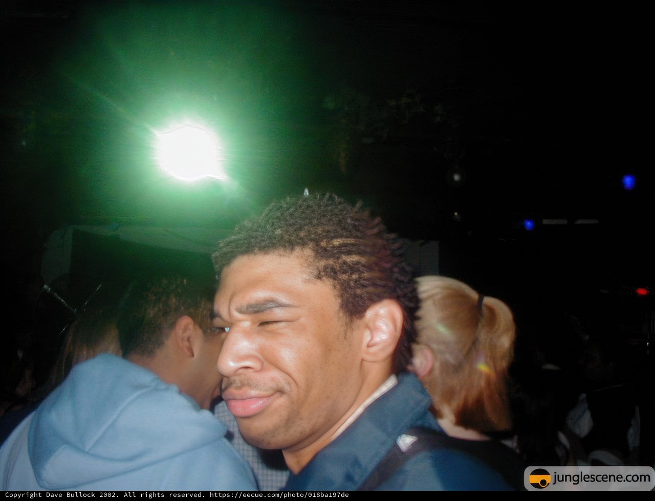 Spotlight on the Night: Portrait of a Man in Black