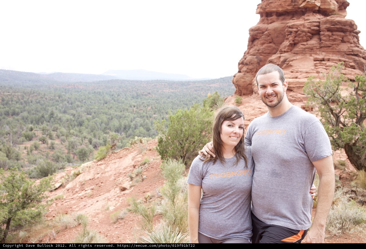 Couple Smiling Atop Sedona Red Rock Overlook