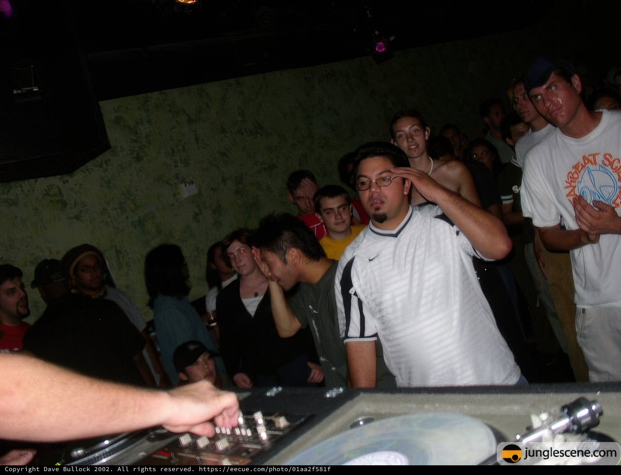 Nightclub DJ Entertains Lively Crowd