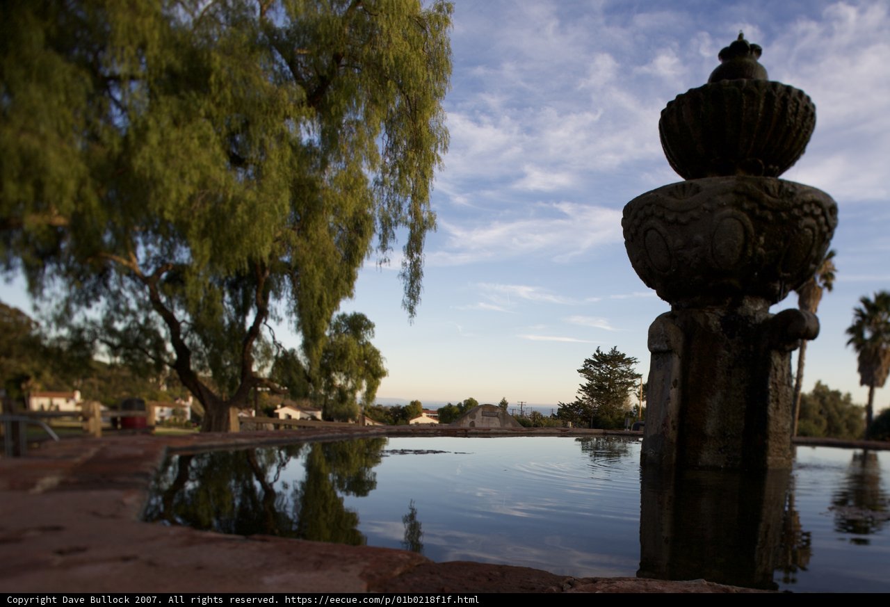 Majestic Willow Tree and Tranquil Fountain in the Park