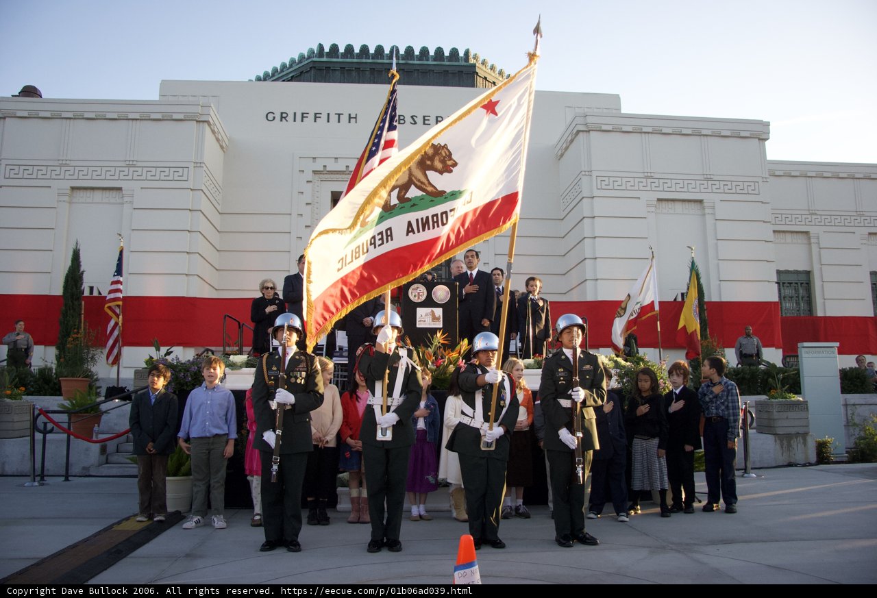 People Gather in Front of Building for Group Performance
