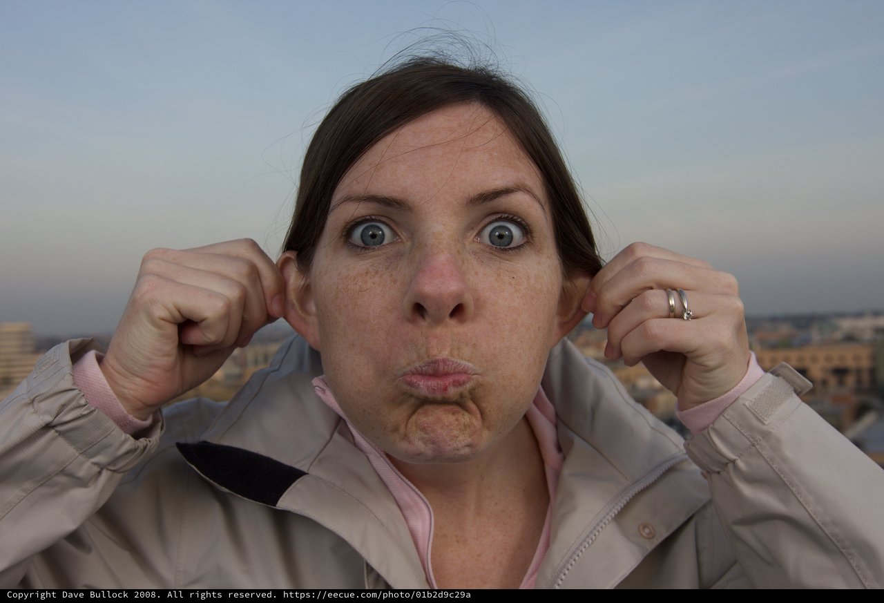 Woman Making a Silly Face on Urban Rooftop