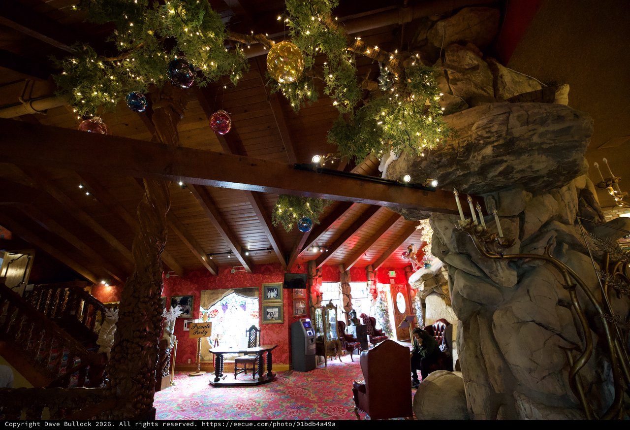 Festive Christmas Lodge Interior with Rustic Stone Fireplace