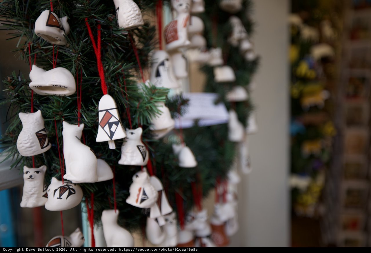 White Ceramic Ornaments on Evergreen Christmas Tree