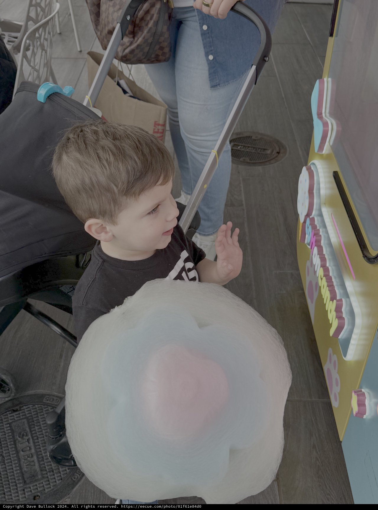 Young Child Enjoying Cotton Candy at Fair