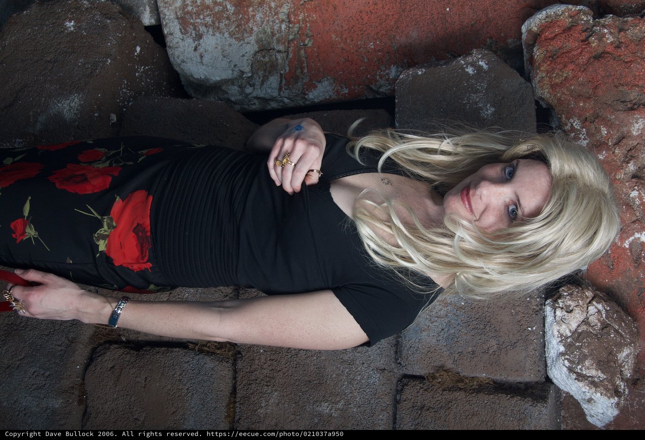 Blonde Halloween Costume Portrait Against Stone Wall