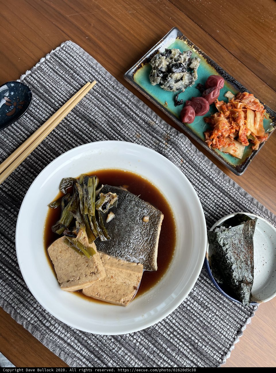 A Delicious Plate of Seafood with Soup and Chopsticks