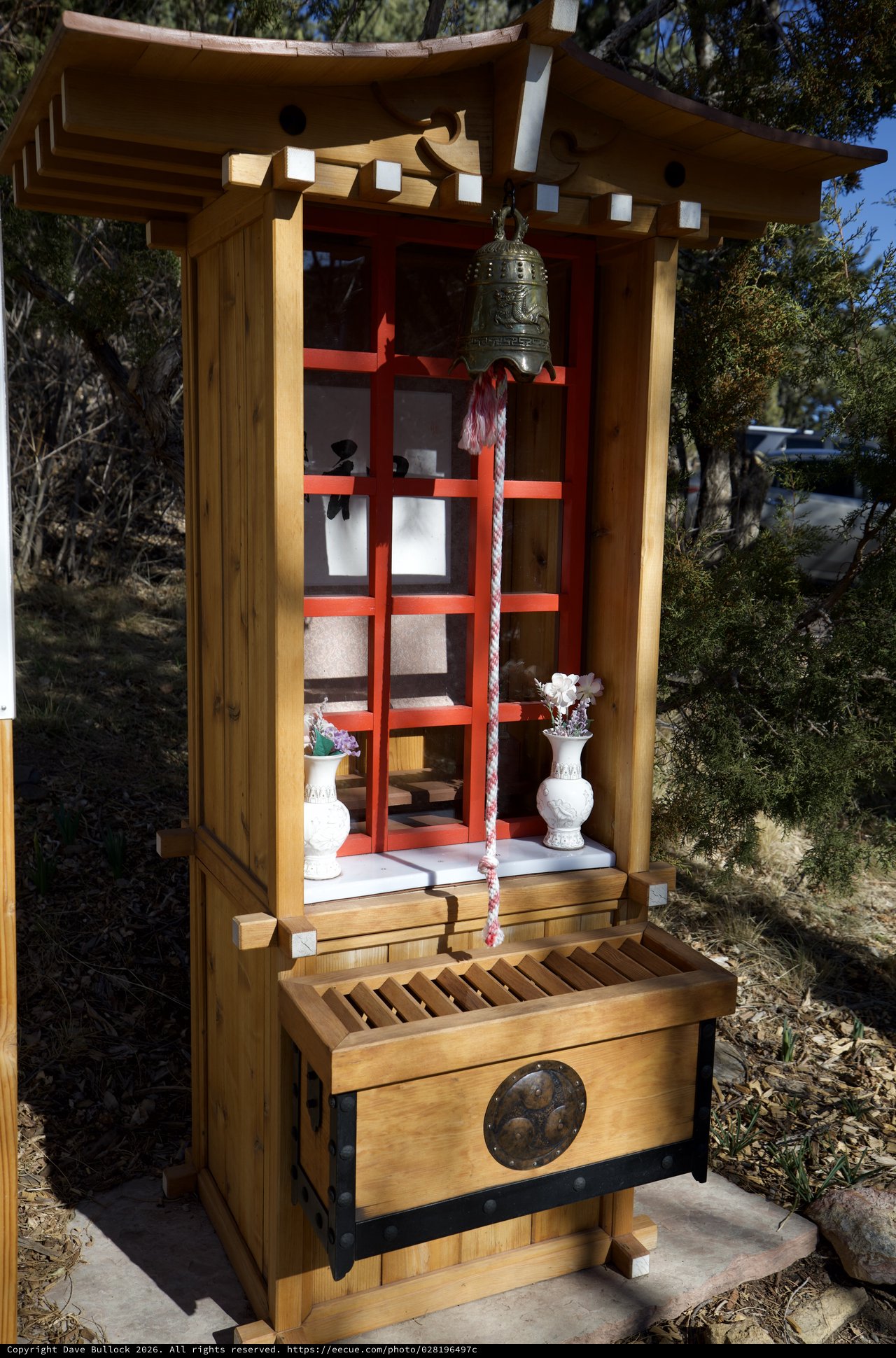 Traditional Japanese Shinto Shrine with Bell and Offerings