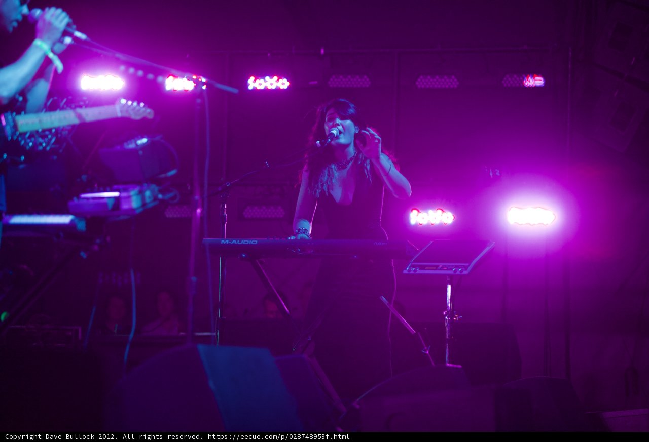 The Female Entertainer Shines in Purple Spotlight