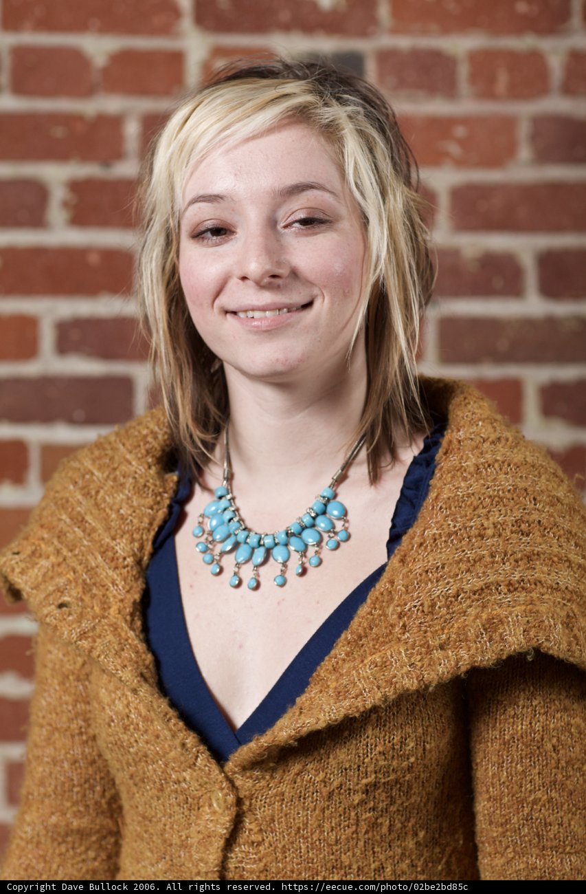 Blonde Beauty in Knitwear and Necklace