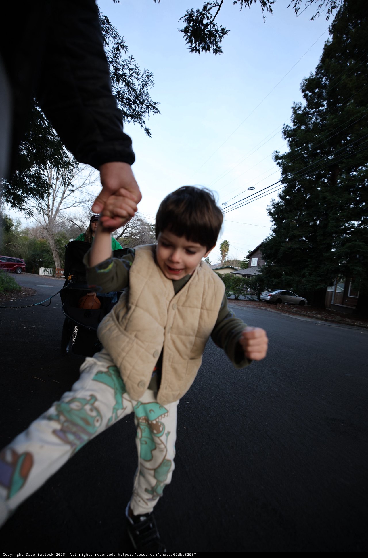 Child's Joyful Stride on Suburban Evening Walk