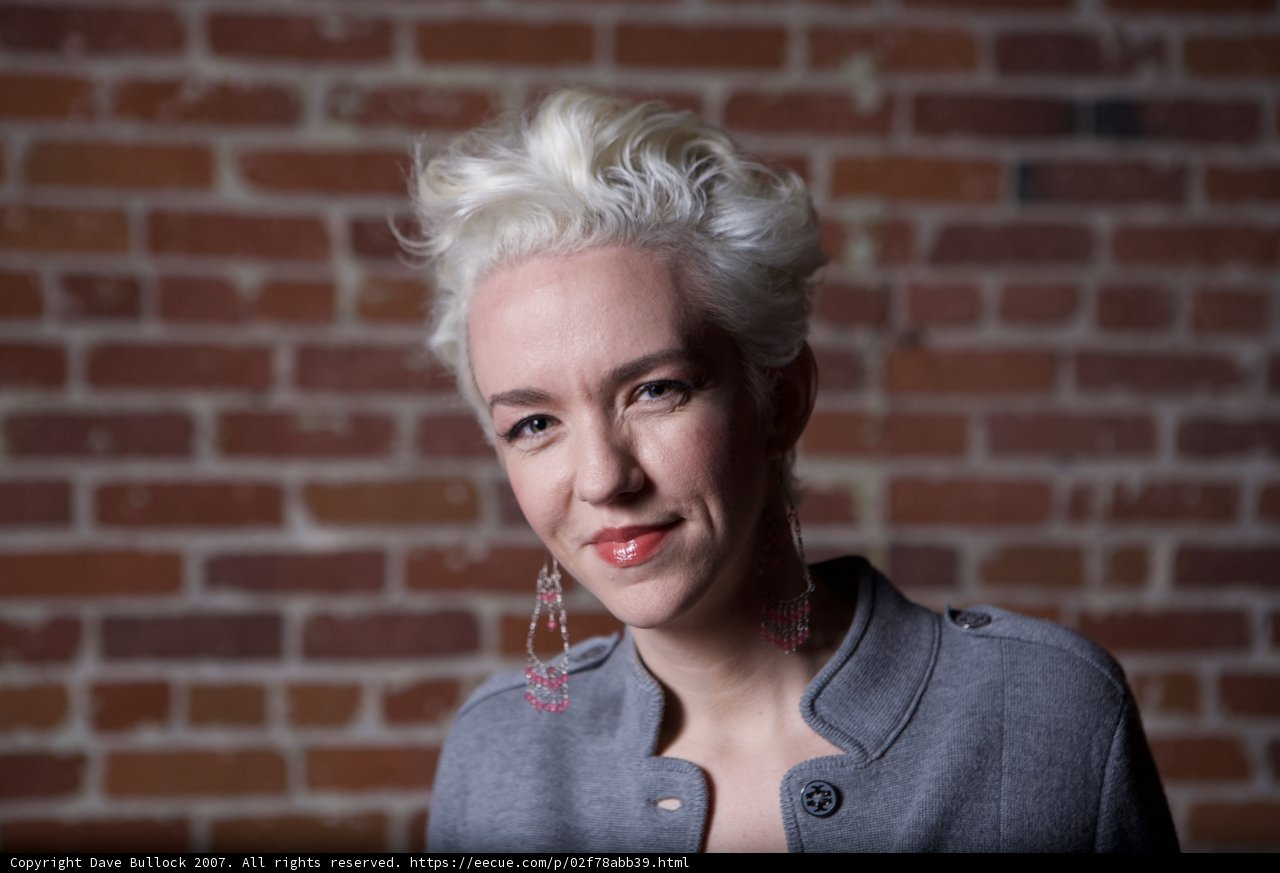 White-haired Lady in Gray Sweater