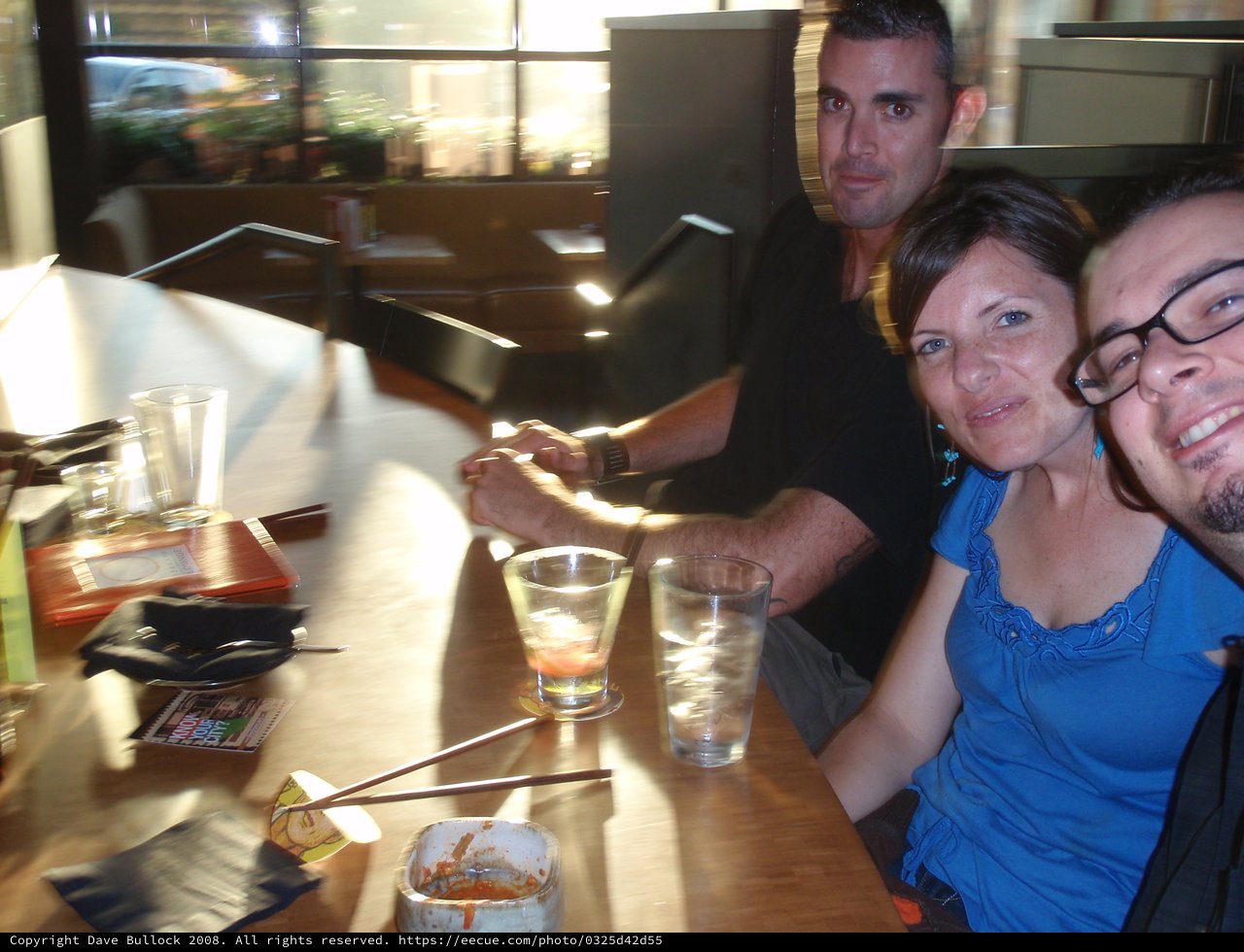Friends Sharing Drinks at a Japanese Restaurant