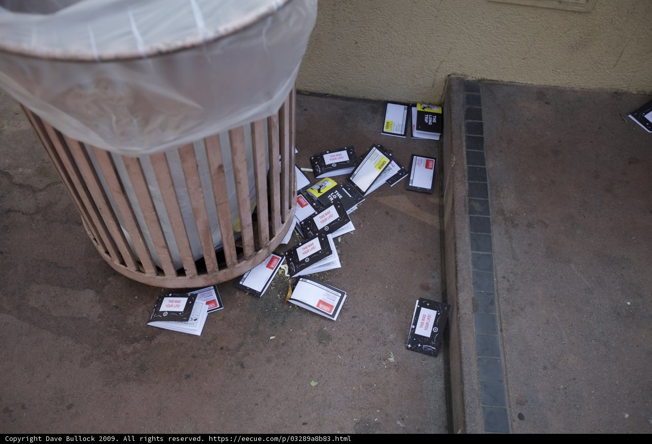 Trash Can Overflowing with Cards