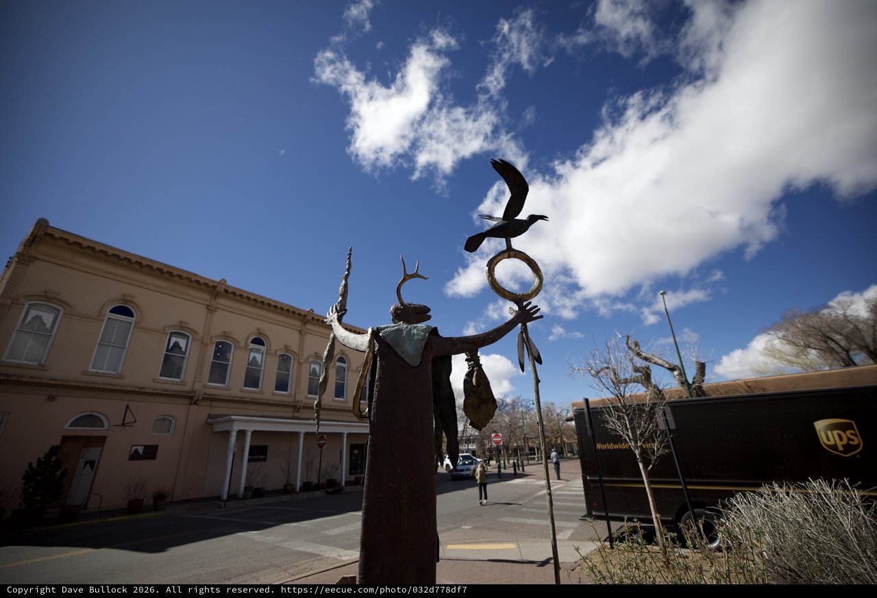 Indigenous Spirit Sculpture Against Santa Fe Sky