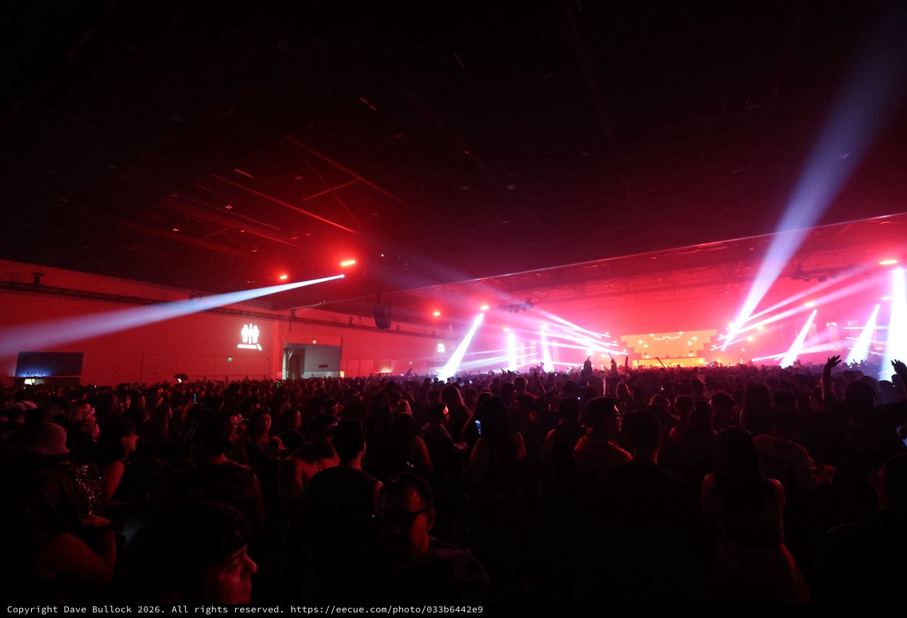 Massive Indoor Rave Ignites Under Red Light Beams