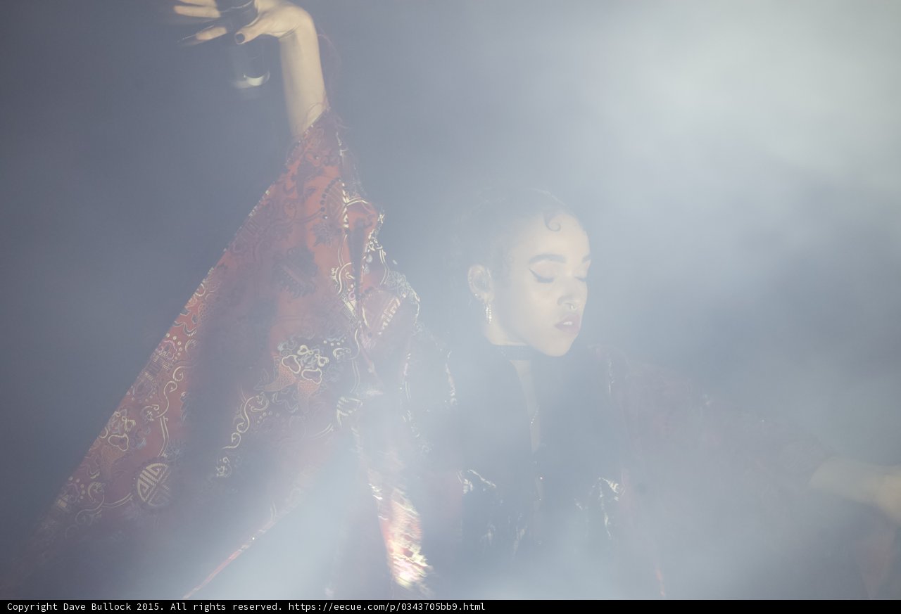 FKA twigs Eyes Closed Contemplative Microphone Raised Heavy Haze Red Brocade Kimono Hoop Earring Ethereal