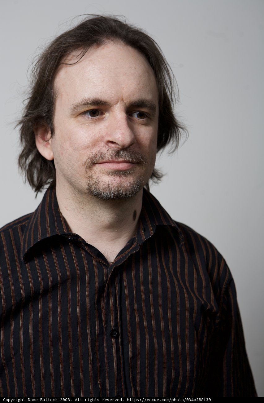 Long-Haired Man in Striped Shirt