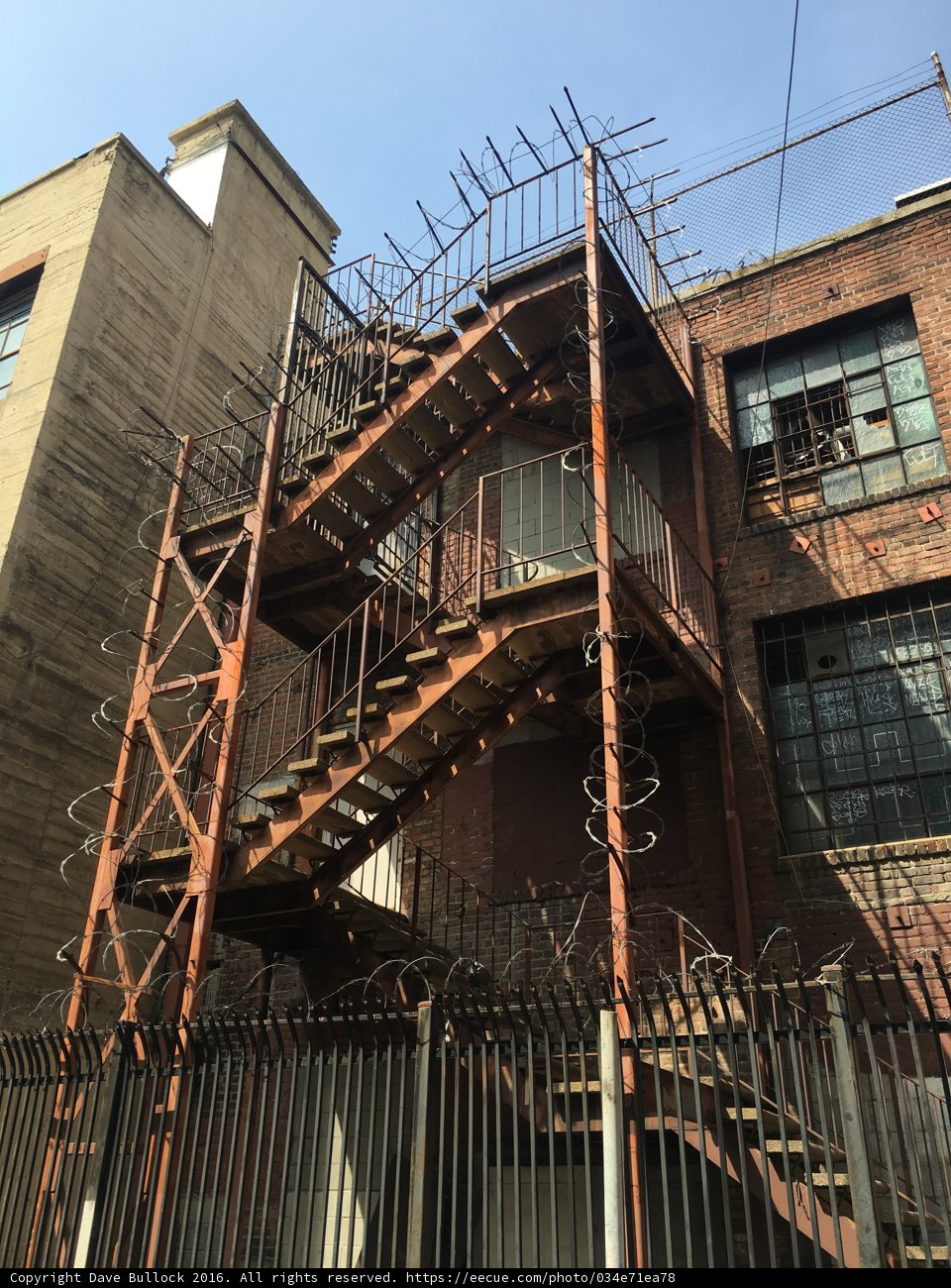Urban Housing with Metal Staircase and Fence
