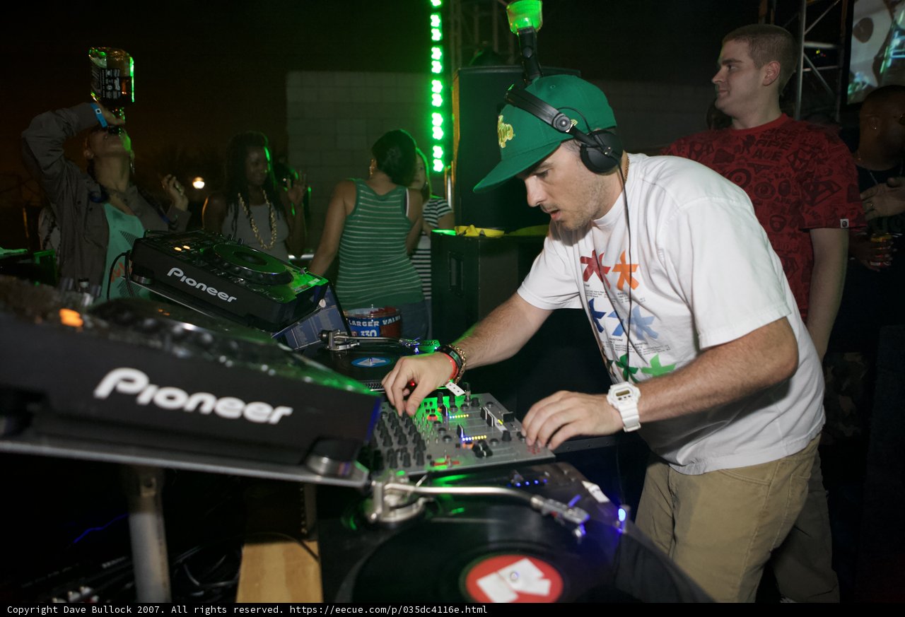 Musical Entertainer in Green Hat