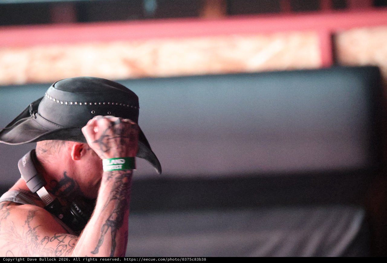 Tattooed Performer Tips Hat at Wobbleland Festival