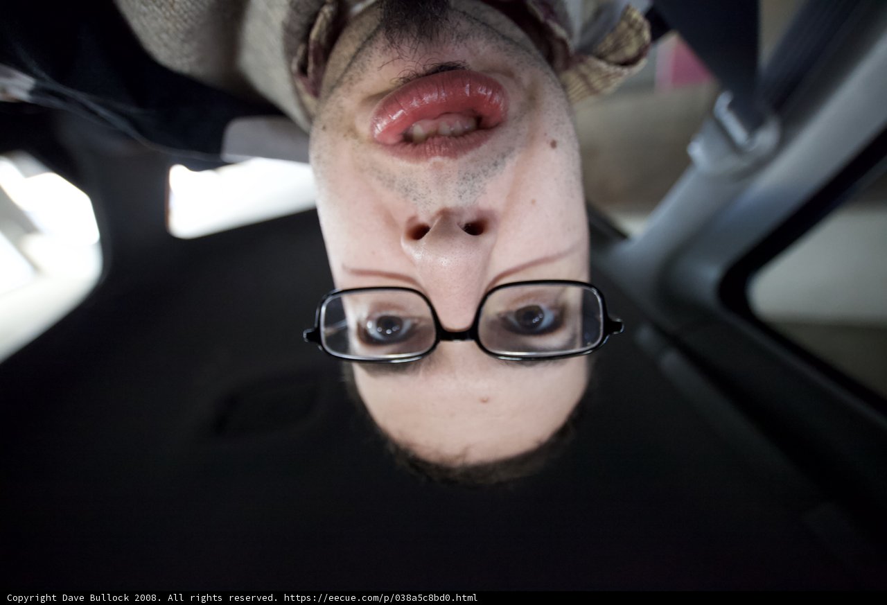 The Cheerful Man with Glasses